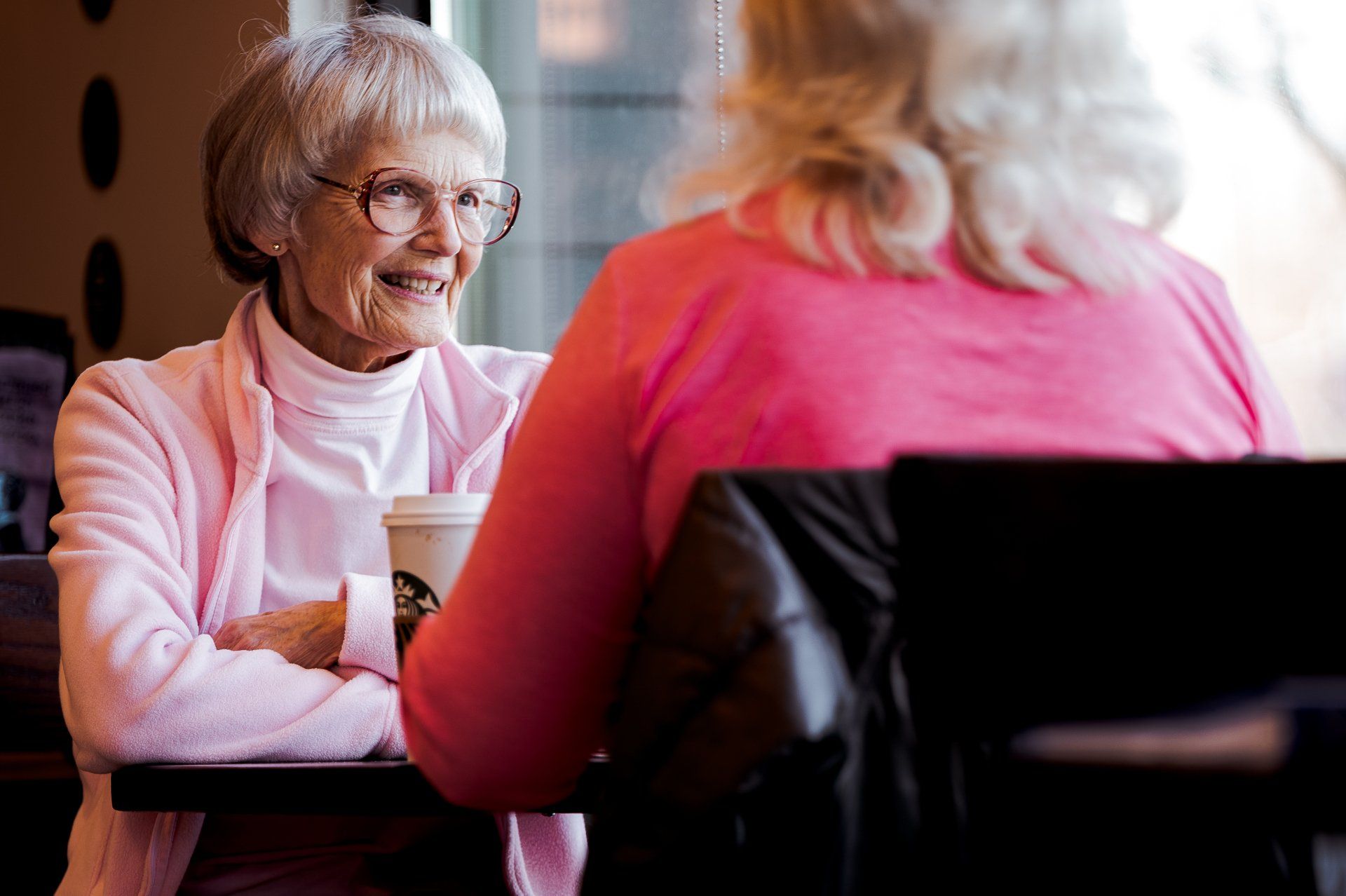 Two elderly women. Honeycomb Care offers live-in care.